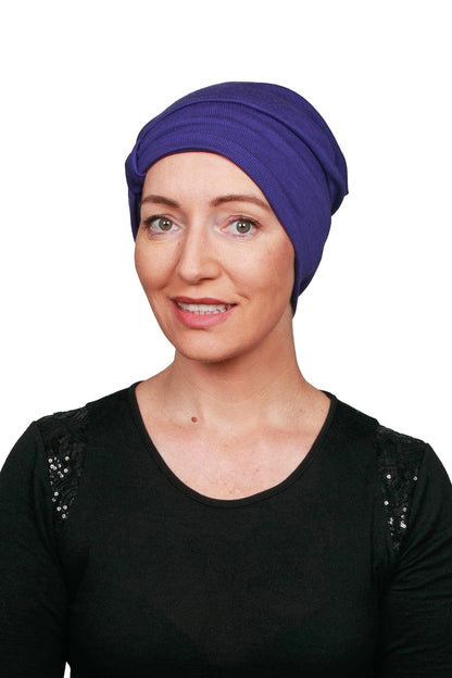 Women Wearing a Purple Cancer Hat Beanie worn as a headcovering
