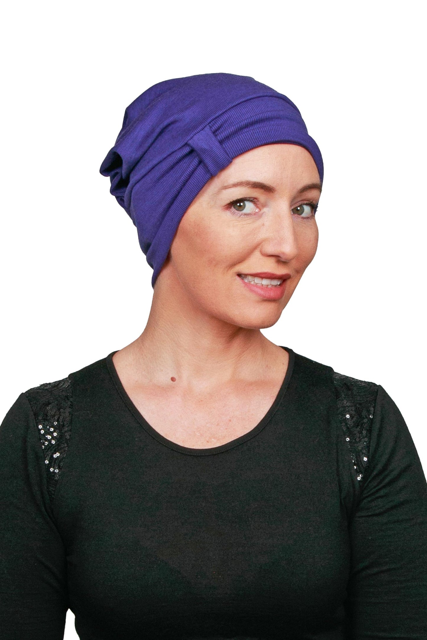 Women Wearing a Purple Cancer Hat Beanie worn as a headcovering
