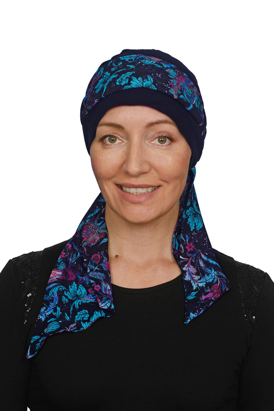 Women wearing a cancer cap with ink floral scarf as a headcovering