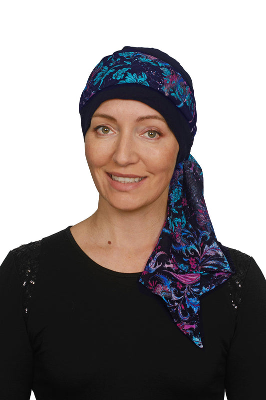 Women wearing a cancer cap with ink floral scarf as a headcovering