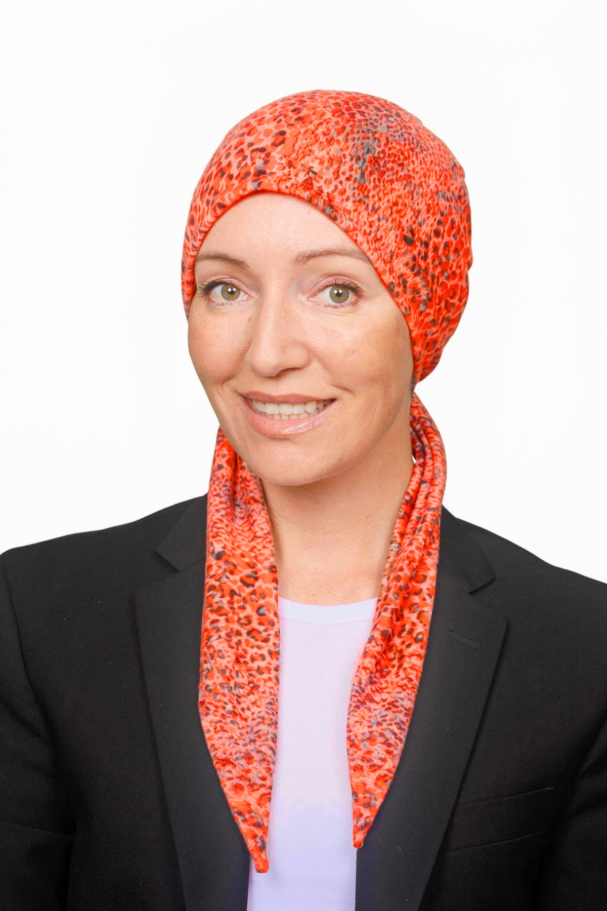 Women wearing an orange cotton wrap hat as a head covering for hair loss