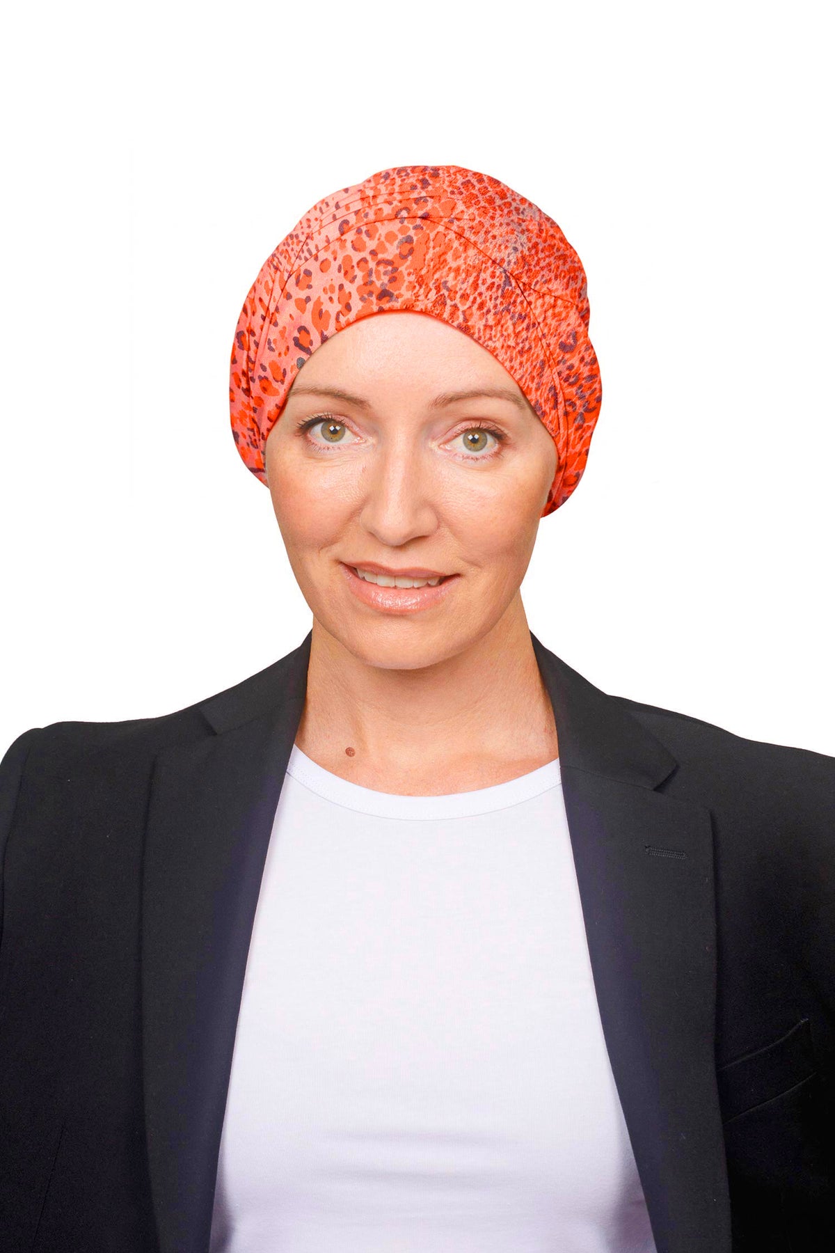 Women wearing an orange cotton wrap hat as a head covering for hair loss